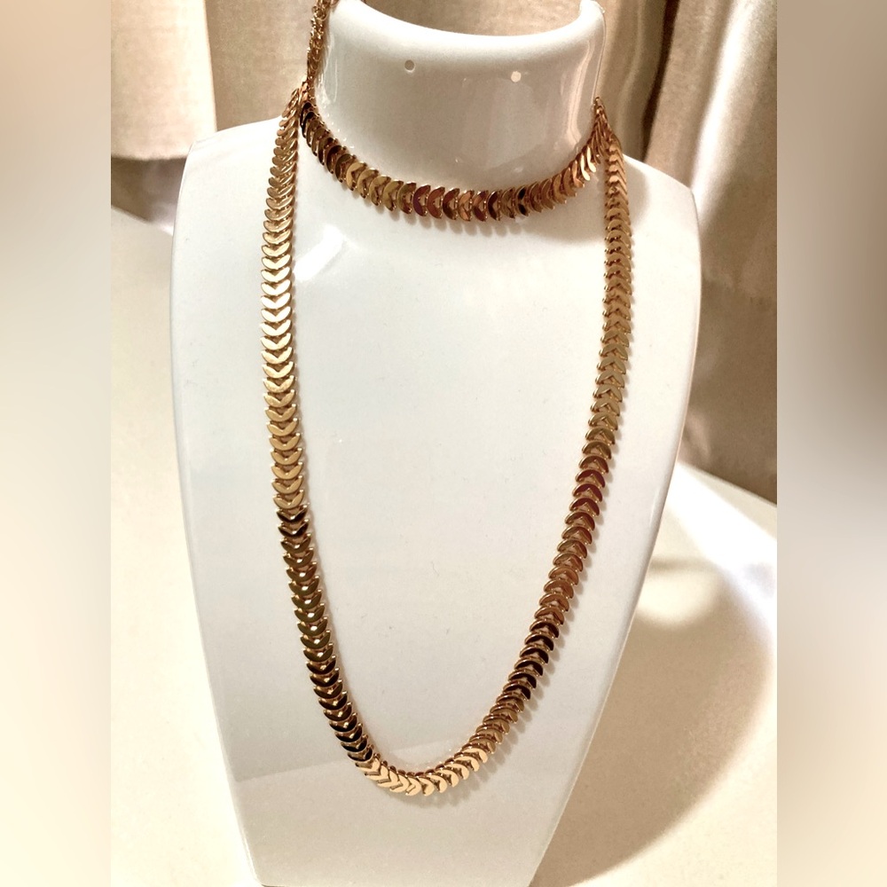 Three piece set. Golden Delicate Leaf-Patterned Chain, Bracelet, and Ring.